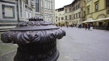 Piazza del Duomo in Florence with tourists visiting it on a cloudy day with the light that enhances the colors video