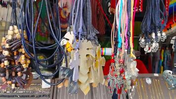 Necklaces for sale in a market stall video