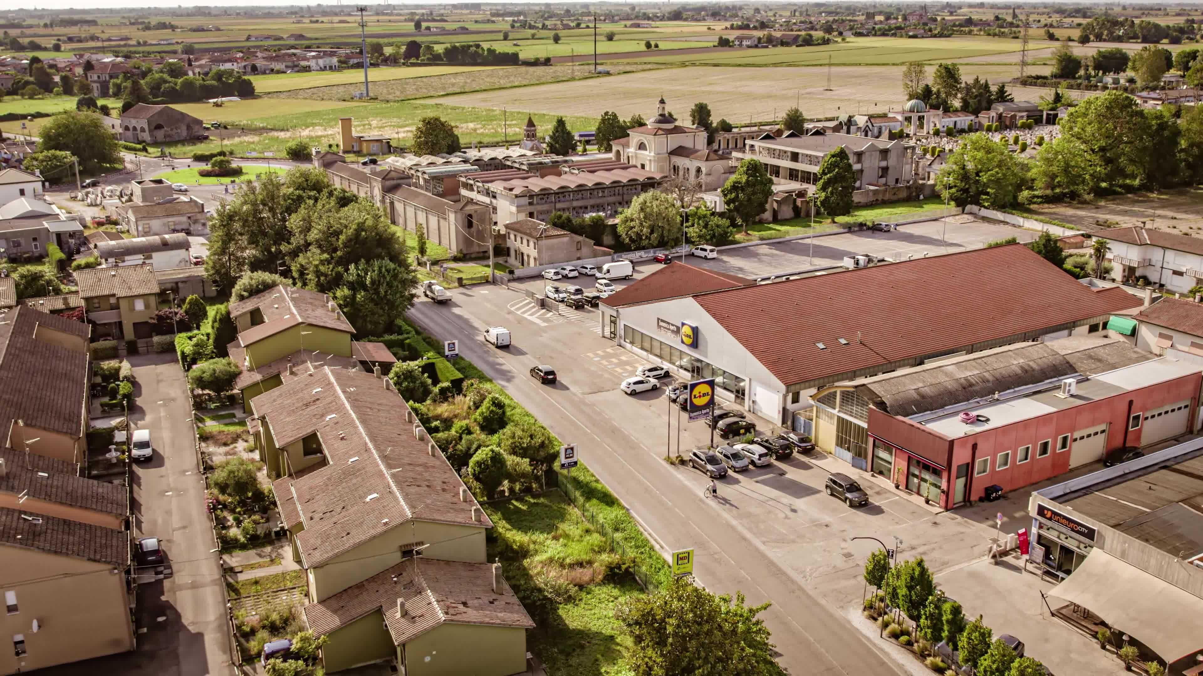 Aerial View of Traffic on a Road in Italian Village amidst Countryside 
