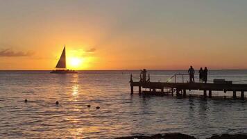 Sunset with sailboat that crosses the sun video