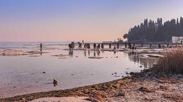 Spectacular landscape of rocky beach in Sirmione overlooking Lake Garda video