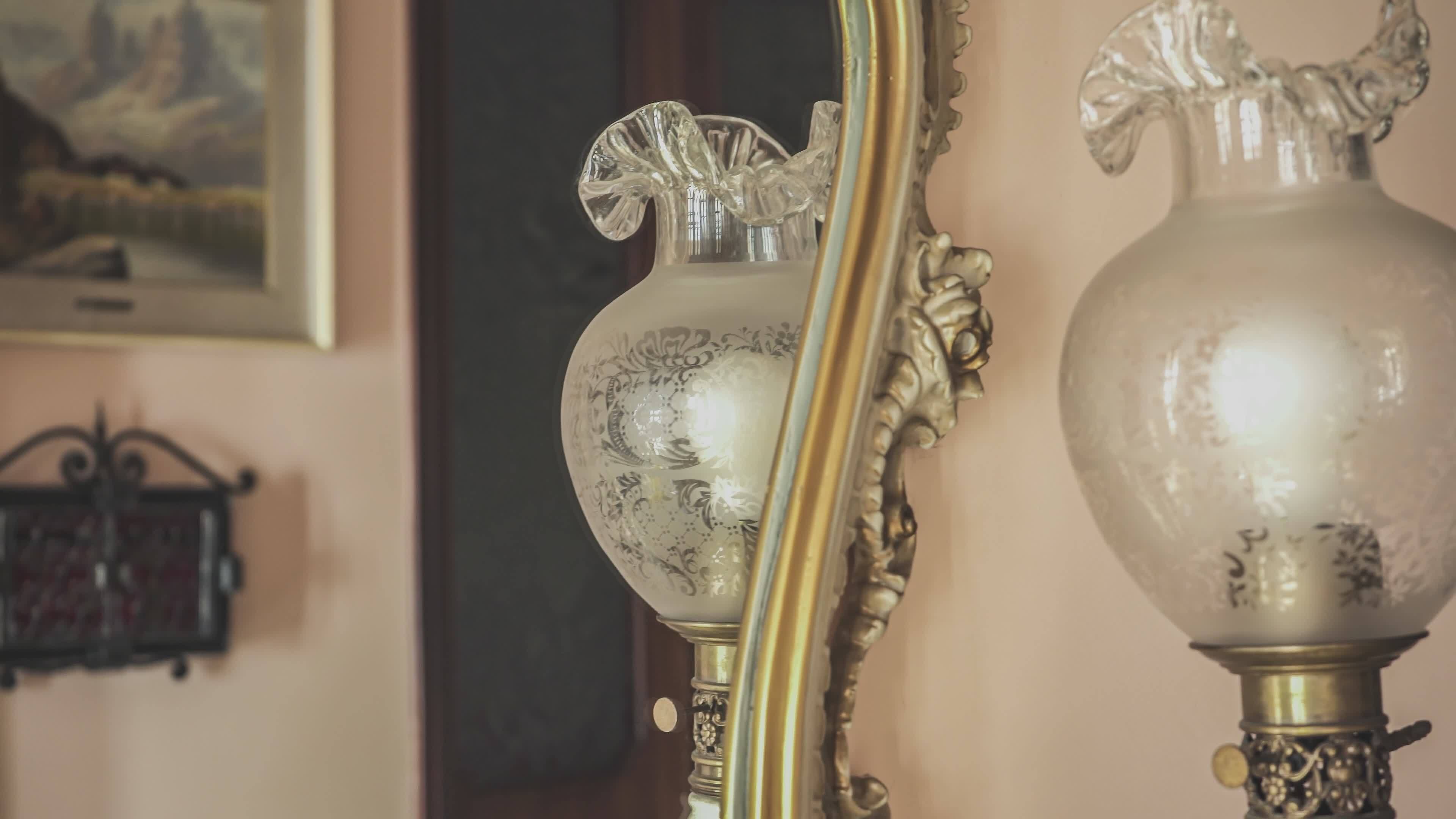 Photos of ancestors and antique lamp, symbolize the passage of time 41473679 Stock Video at Vecteezy