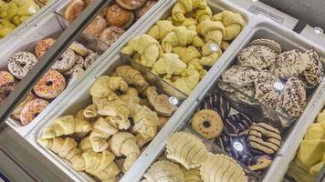 Frozen brioches and donuts in a shop video