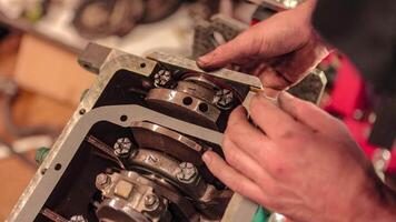 Mechanic's Hands Restoring Vintage Engine video