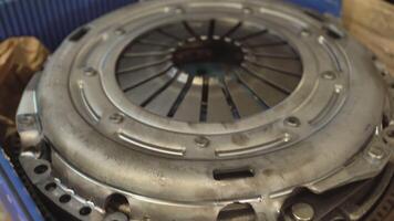 MILAN ITALY 6 MAY 2021 Detail of Car clutch spare part in a workshop video