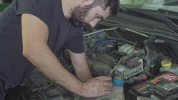 MILAN ITALY 5 AUGUST 2021 Mechanic puts his hands in the engine video