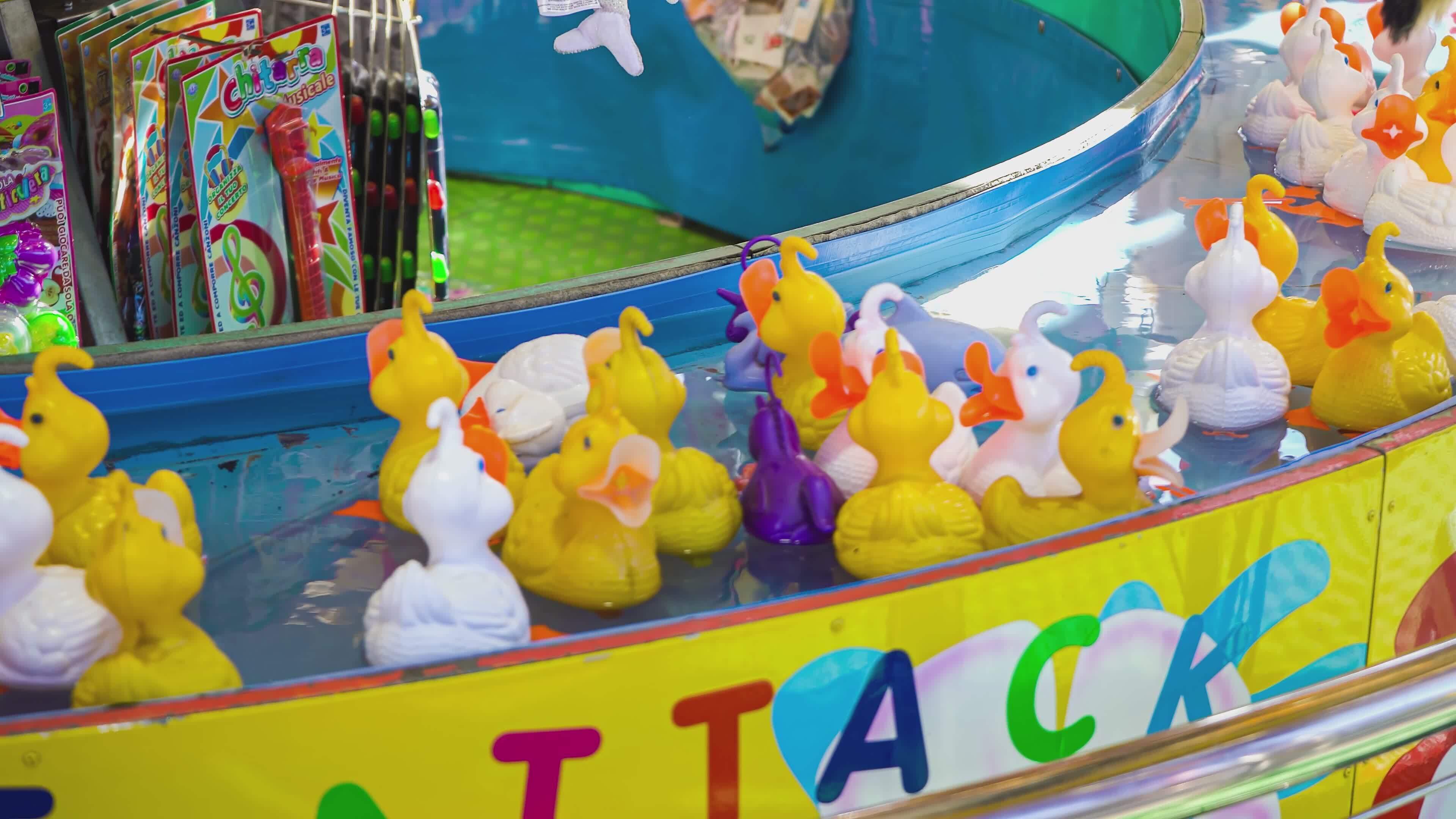 ROVIGO ITALY 30 OCTOBER 2021 Cool Rubber duckies running around in arcade  hunting game Fairground classic game of rubber ducks hook fishing 41476042  Stock Video at Vecteezy