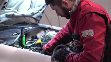 MILAN ITALY 20 JANUARY 2020 Mechanic working on the engine in the workshop video