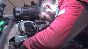 MILAN ITALY 20 JANUARY 2020 Mechanic repairs car engine in a workshop video