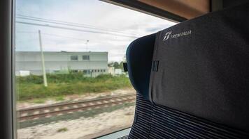 MODENA ITALY 01 OCTOBER 2020 Trenitalia logo Train seat detail near window during travel video