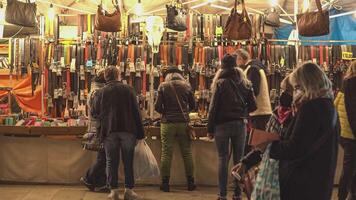 ROVIGO ITALY 30 OCTOBER 2021 Stall of belts at the street market with people video