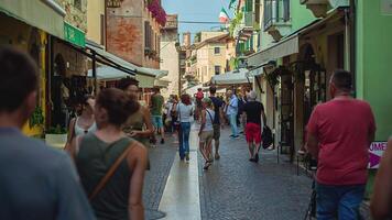 LAZISE ITALY 16 SEPTEMBER 2020 Alley with people and tourists walking in Lazise in Italy video