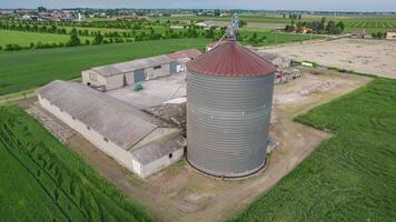 Drone video flying around a traditional drying house in a rural setting