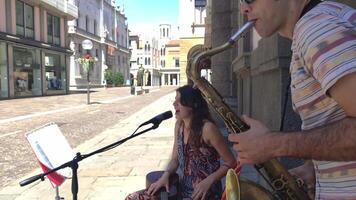 PADOVA ITALY 18 JULY 2020 Couple of Street Musician artists plays on Padua streets in Italy video