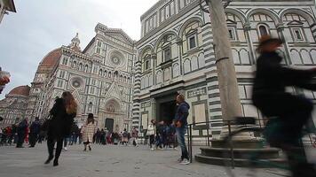 Detail of the Piazza del Duomo in Florence with tourists visiting it on a cloudy day with the light that enhances the colors video