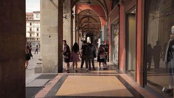 BOLOGNA ITALY 17 JUNE 2020 View of the arcades of Bologna with people passing by video