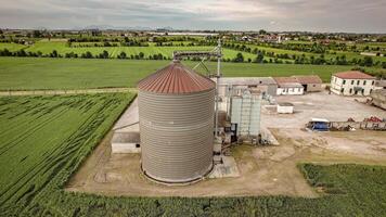 Drone video flying around a traditional drying house in a rural setting