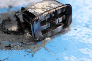 Toaster after fire. Household electrical appliance fire hazard photo