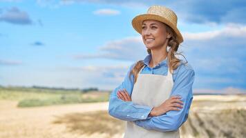 Woman farmer straw hat apron standing farmland smiling Female agronomist specialist farming agribusiness Happy positive caucasian worker agricultural field photo