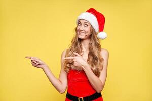 Woman christmas Santa Hat yellow studio background photo