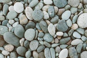 abstract background with dry round peeble stones. Sea stone close up photo