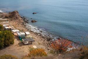 autumn camping on the beach near the mountains photo