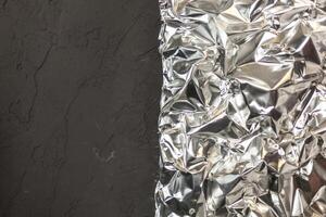 Full frame take of a sheeT of crumpled silver aluminum foil photo