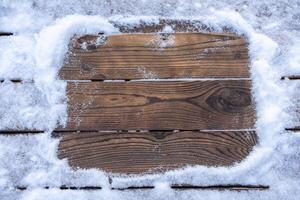 Winter background. Empty wooden plank with snow border, copy space for text photo