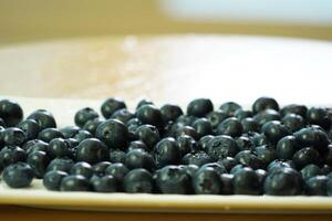 closeup view of Blueberries in a plate on the table photo