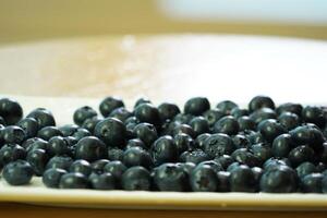 closeup view of Blueberries in a plate on the table photo