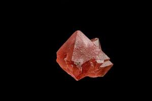 macro mineral stone pink fluorite on a black background photo