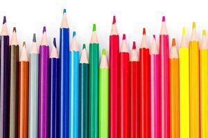 macro multicolored pencils on a white background photo