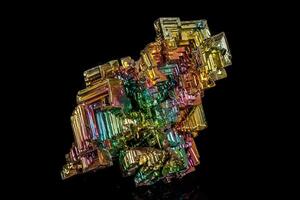 Macro of the stone bismuth mineral on a black background photo