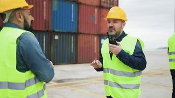 two men in hard hats talking to each other video