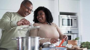 a group of people cooking together in the kitchen video