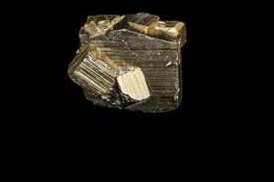 Macro mineral stone Pyrite on a black background photo