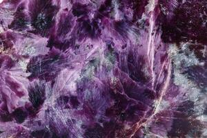 macro mineral stone Charoite on a white background photo