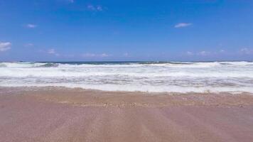 Big waves on beautiful sandy beach - wide angle shot video