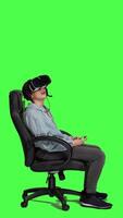 Profile Frustrated gamer losing at video games on mobile phone app, playing with vr glasses and artificial intelligence against greenscreen. Displeased furious girl gets angry with her failure. Camera A.