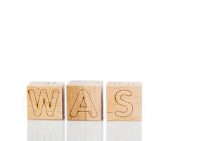 Wooden cubes with letters was on a white background photo