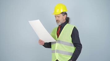 Engineer looking at camera and making positive gesture. video