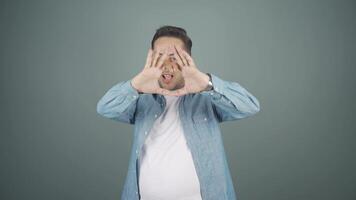 Man making heart sign at camera. video