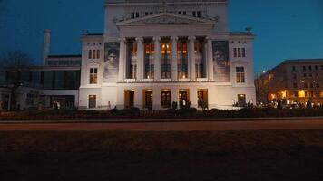 28 February, 2024 - Riga, Latvia. Evening Elegance. Latvian National Opera in Riga Glowing under Night Sky video