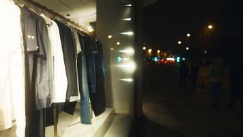 Blurred image of buildings window with clothes on hanging racks video