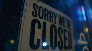 Close up of an Sorry were closed sign at window display video