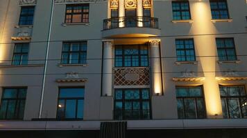 A commercial building with a balcony and many windows in the city video