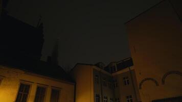 Dark hallway with brick wall arch doorway at night in building video