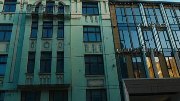 Tower block with many windows against electric blue sky video