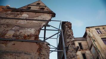 Old vs new. An ancient building adorned with metal carcas inside video