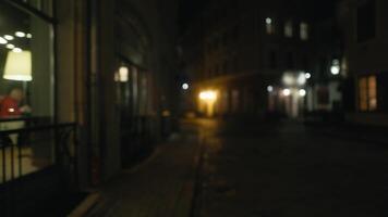 a blurry picture of a dark alleyway at night video